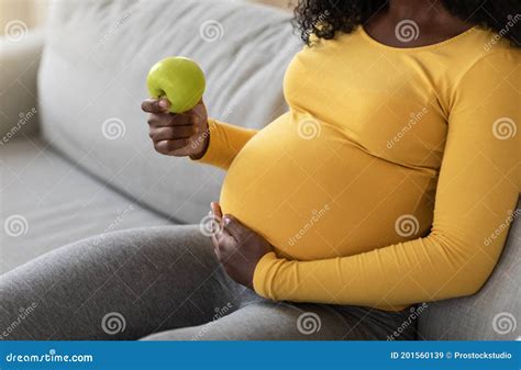 closeup of black pregnant woman holding green apple stock image image of expectant maternity