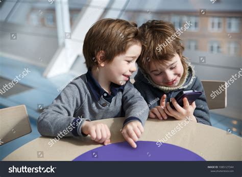 Two Little Boys Play Games On Stock Photo 1085127344 Shutterstock