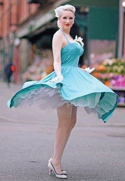 A Beautiful View Of Her Lovely Petticoat And Stocking Tops As Her Dress Blows Up Wind Blown