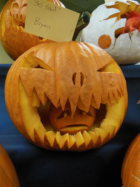 big pumpkin eating a little pumpkin pumpkin carving halloween pumpkin carving pumpkin