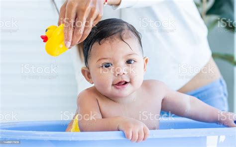 Adorable Caucasian Little Baby Daughter Girl Taking Bath In Baby