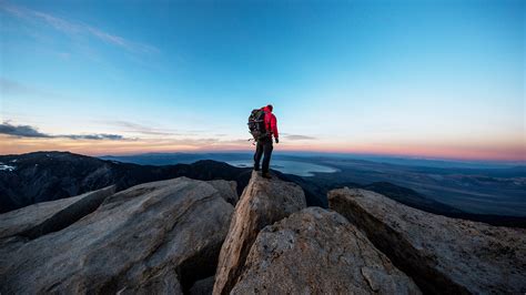 Climber On The Summit Of A Peak Watching Sunset Sierra Mountains