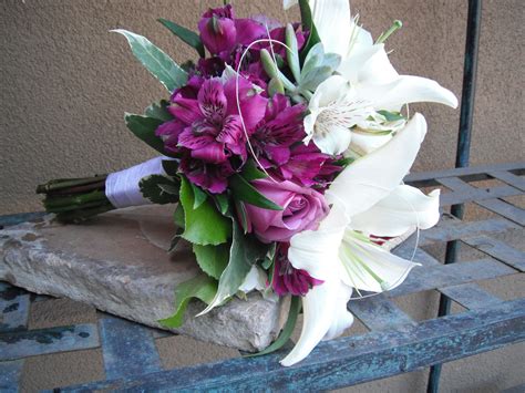 Real wedding photo waldorf astoria las vegas white and gold wedding andrea eppolito events bride in strapless wedding dress white ivory rose wedding bouquet white rose and white anemone with dark center green leaves. Bouquet of white and dark lavender | Lovely colors ...