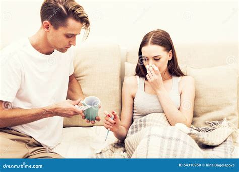 Couple Care Sick Woman Blowing Her Nose Man Take A Cup With Hot Drink