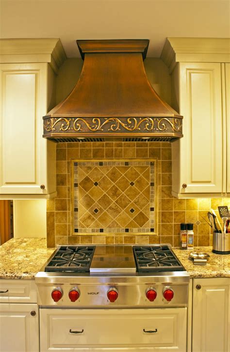 The hood looks and works great. Copper hood in ivory kitchen | Range hood, Ivory kitchen ...