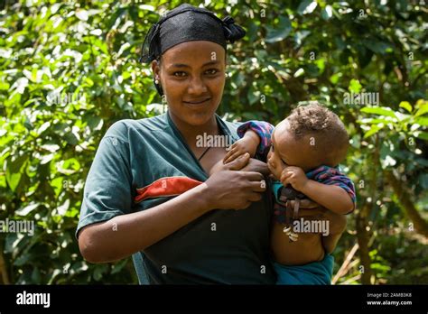 Ethiopian Mother Breastfeeding A Child Outside Ura Kidane Mehret