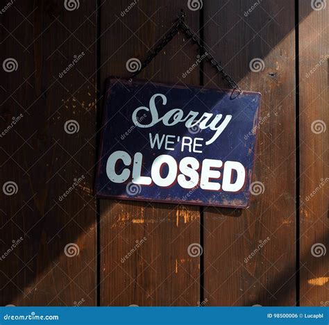 Sorry We Re Closed Blue And White Sign On Old Wooden Door With A