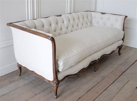 Have you recently inherited or purchased an antique sofa and want to know its value? Antique French Louis XV Style Button Tufted Sofa in Organic Belgian Linen at 1stdibs