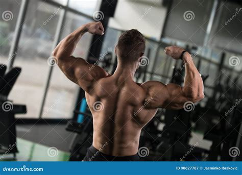 Muscular Man Flexing Back Muscles Pose Stock Image Image Of Handsome