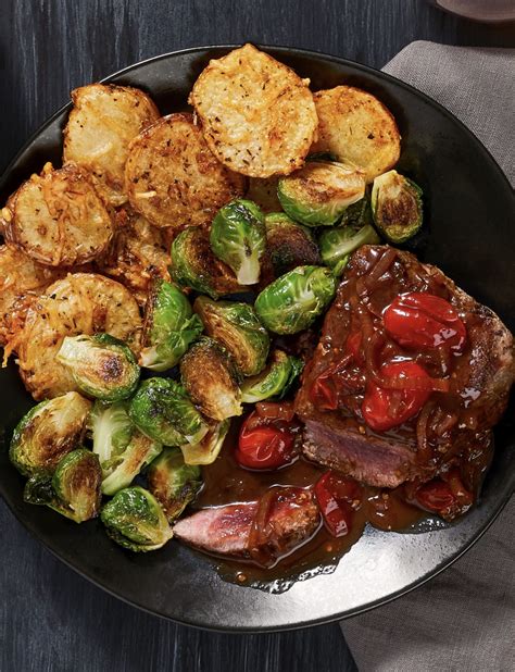 Looking for the best beef tenderloin roast recipe? Beef Tenderloin and Burst Balsamic Tomatoes with Cheesy Potato Rounds and Roasted Brussels ...