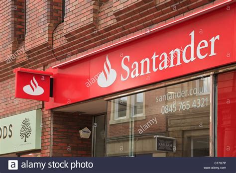 Asegurate con santander y que tu única preocupación sea disfrutar. Santander bank logo and sign above the local branch front ...