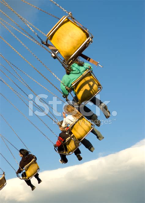 Carnival Swings In The Blue Sky Stock Photo Royalty Free Freeimages
