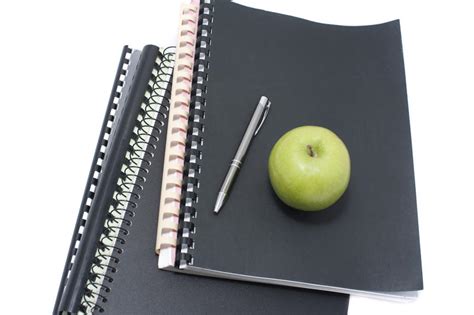 Free Stock Photo 6987 Apple And Pen On Notebooks Freeimageslive