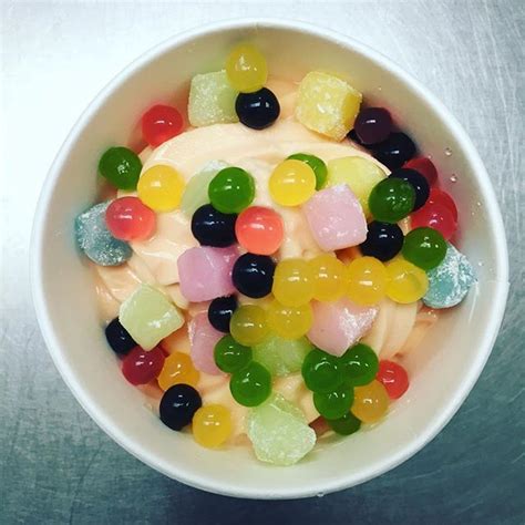 A Bowl Filled With Gummy Bears On Top Of A Table