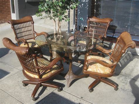 This reupholstered chair and ottoman are a great start to the design update of this beautiful sunroom. UHURU FURNITURE & COLLECTIBLES: SOLD - Sun Room Table and ...