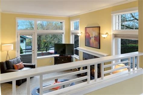 Contemporary formal enclosed living room in london with white walls, medium hardwood flooring, a standard fireplace and brown floors. Madison Park Staged Townhouse - Traditional - Living Room ...