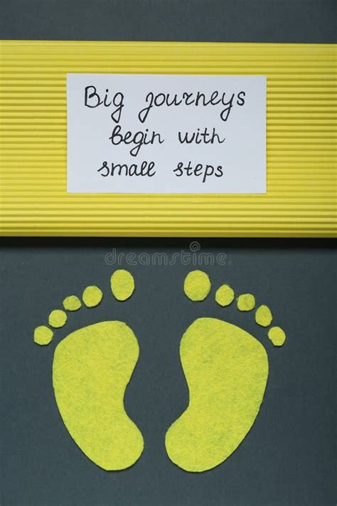 Card With Phrase Big Journeys Begin With Small Steps And Paper Feet On