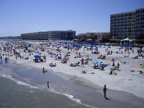 Many People Are On The Beach And In The Water
