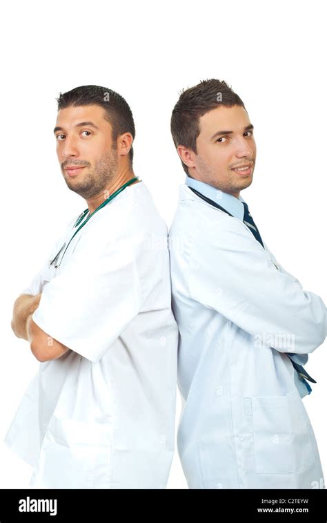 Two Friendly Smiling Doctors Men Standing Back To Back With Arms Folded
