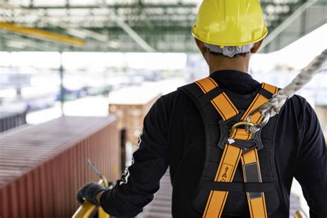 Construction Worker Wearing Safety Harness And Safety Line Worki