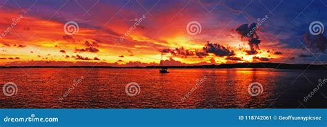 Golden Colored Coastal Panoramic Sunrise Seascape Cloudscape Stock