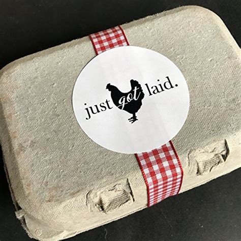 A Sticker That Says Just Got Laid On Top Of An Egg Carton With A Red