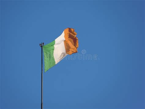 Irish Flag Of Ireland Over Blue Sky Stock Photo Image Of Flags