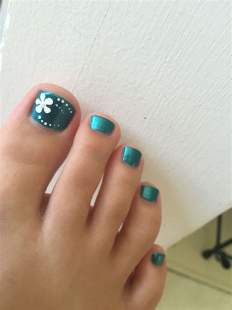 Maybe you would like to learn more about one of these? Blue toenails with flower #nails #toenails #toes | Nails ...