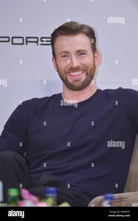 American Actor Chris Evans Smiles At A Press Conference For The 2014