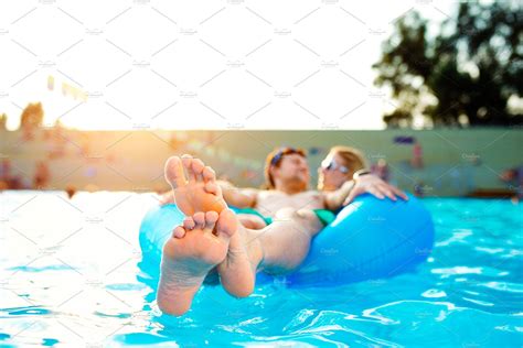 Couple In Inflatable Ring In Pool Summer And Water ~ People Photos