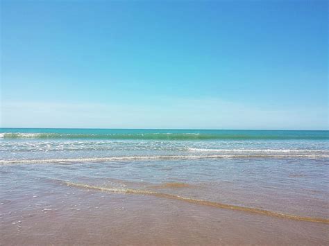 Blue Skies And Clear Water Photograph By Natalie Hardwicke Fine Art