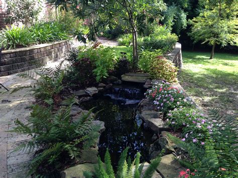 Maybe you would like to learn more about one of these? Pond, landscaping on retaining wall | Landscape, Retaining ...