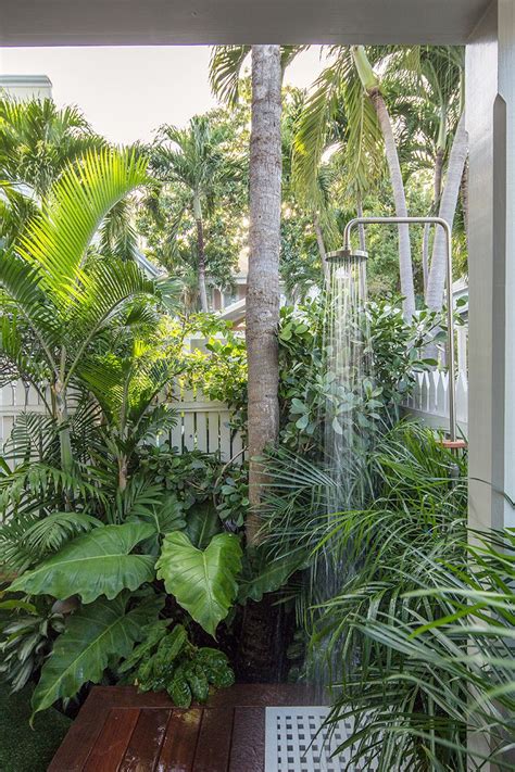 Lush Tropical Planting And An Outdoor Shower Help Create The Sense Of