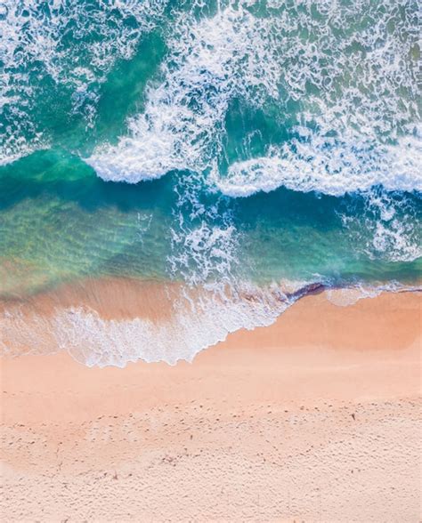 Premium Photo Aerial Top View Of Sandy Beach With Stunning Waves And