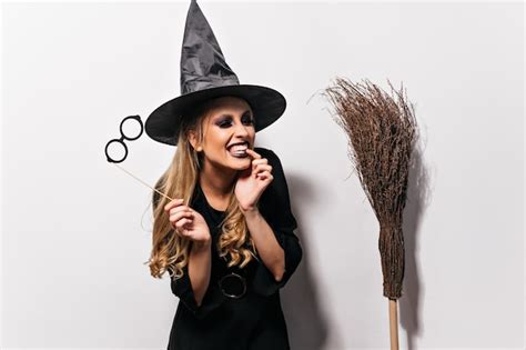 Free Photo Laughing Curly Witch Enjoying Halloween Indoor Portrait