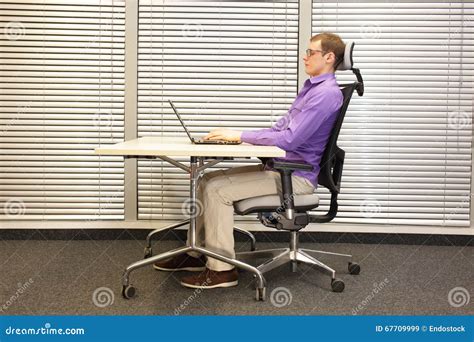 Correct Sitting Position At Workstation Man On Chair Working With