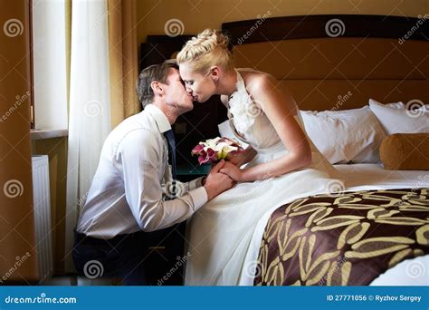 Romantic Kiss Happy Bride And Groom In Bedroom Stock Photography