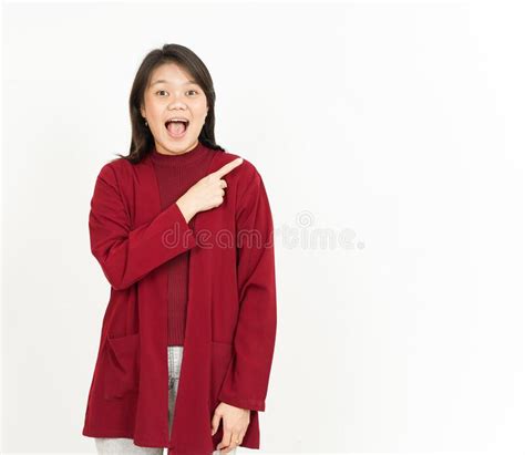 showing and pointing aside of beautiful asian woman wearing red shirt isolated on white stock