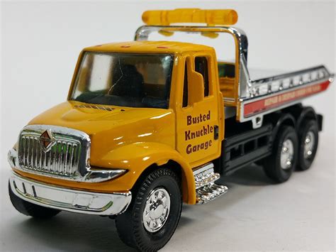 Showcast International Yellow Busted Knuckle Flatbed Tow Truck 164