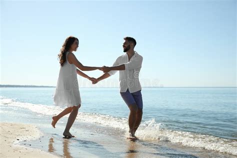 Happy Couple Having Fun On Beach Near Sea Honeymoon Trip Stock Image Image Of Enjoying
