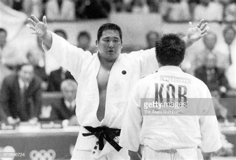 Hitoshi Saito Of Japan And Cho Yongchul Of South Korea Compete In The