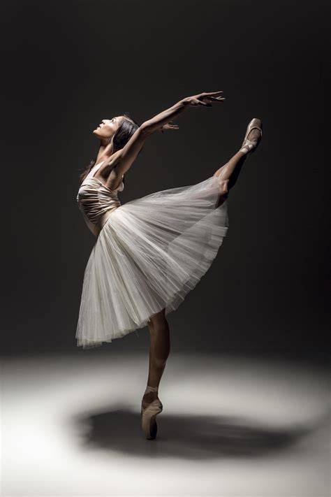 A Ballerina In A White Tutu And Ballet Shoes