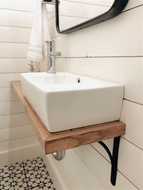 A brand new bathroom vanity can completely transform your. Wall mounted sink with custom shelf and shiplap walls ...