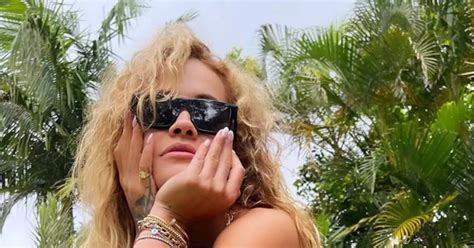 Rita Ora Flaunts Figure As She Goes Topless For Poolside Snap