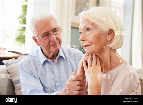 Senior Man Comforting Woman With Depression At Home Stock Photo Alamy