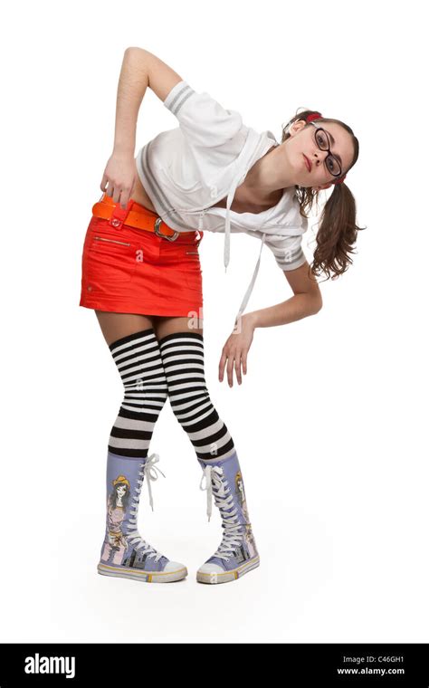 Girl In Striped Socks Mini Skirt And Pigtails On A White Background