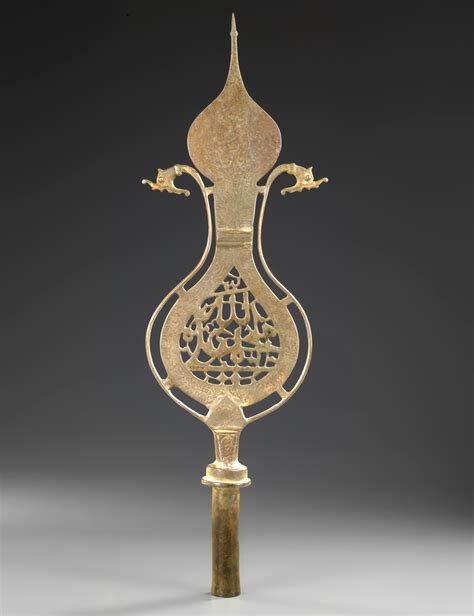 a persian pierced bronze processional standard alam 20th century