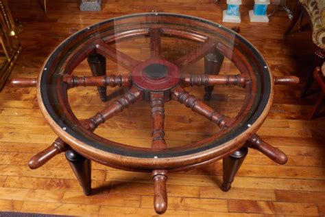 You can get the best discount of up to 80% off. Antique Ship's Wheel as Coffee Table with Glass Top at 1stdibs