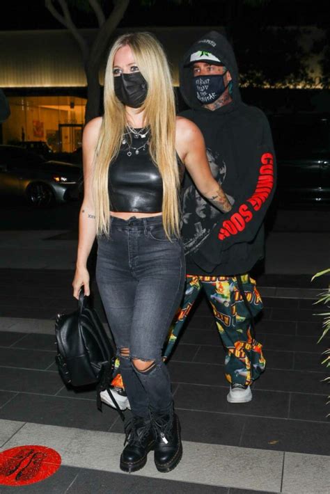 Avril Lavigne In A Black Outfit Arrives For Dinner At Boa Steakhouse With Mod Sun In West