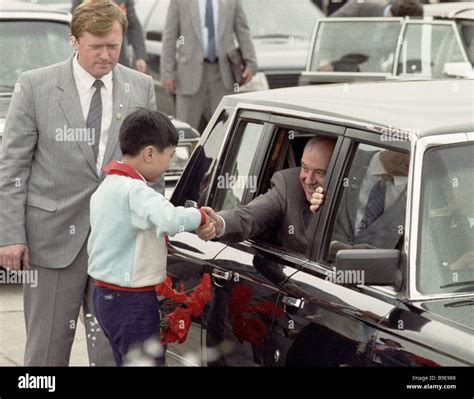Soviet Leader Mikhail Gorbachev Greeting A Chinese School Student
